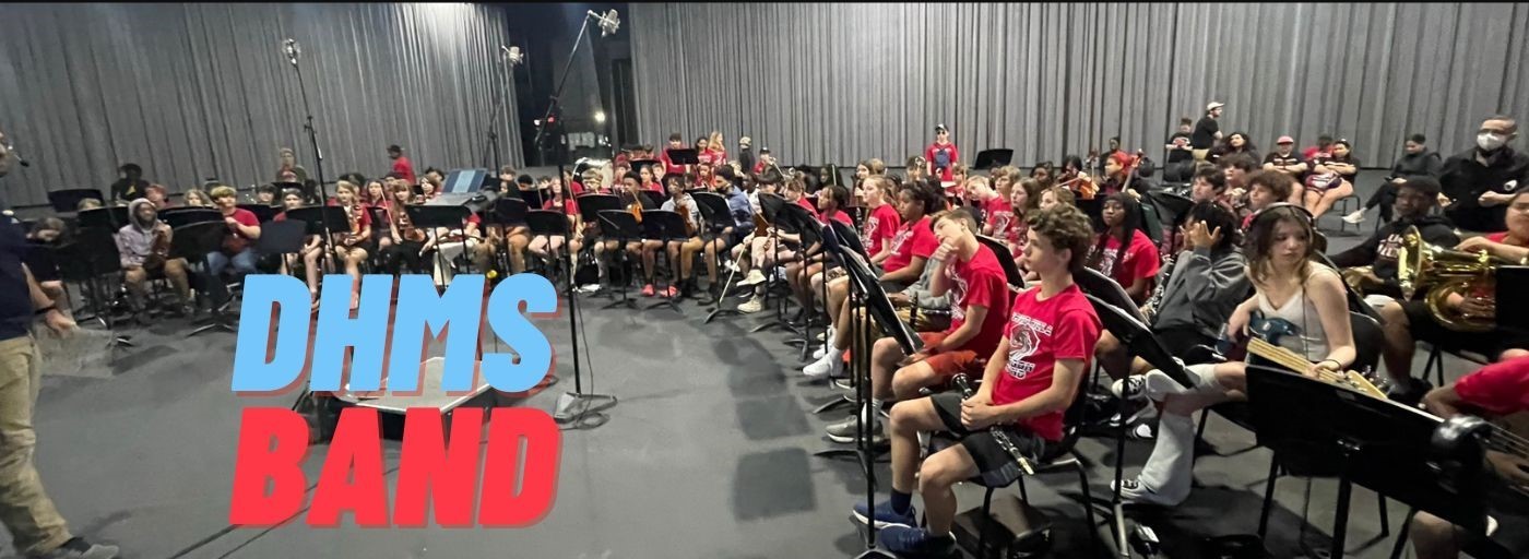 DHMS Band (photo of band in large practice room at Universal Studios)